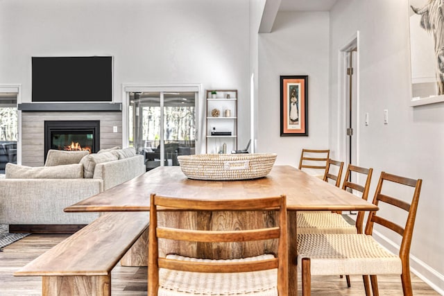 32 Walden Way, New Buffalo, MI 49117 - dining area with light wood finished floors and a glass covered fireplace