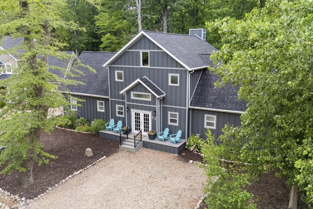 32 Walden Way, New Buffalo, MI 49117 - rear view of property with roof with shingles, french doors, a wooden deck, and board and batten siding