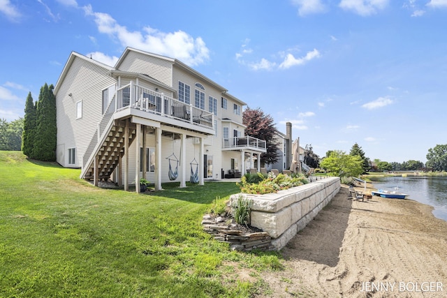 7066 Country Springs Dr SW, Byron Center, MI 49315 - back of property with a lawn, stairs, and a deck with water view
