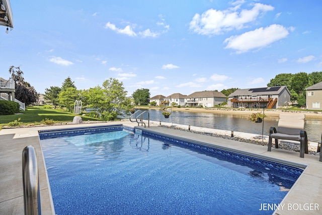 7066 Country Springs Dr SW, Byron Center, MI 49315 - outdoor pool with a residential view, a water view, and a patio area