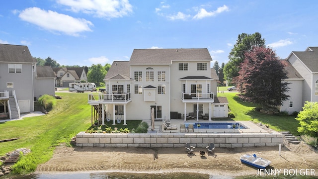 7066 Country Springs Dr SW, Byron Center, MI 49315 - back of house featuring a patio, a balcony, a yard, an outdoor pool, and a residential view
