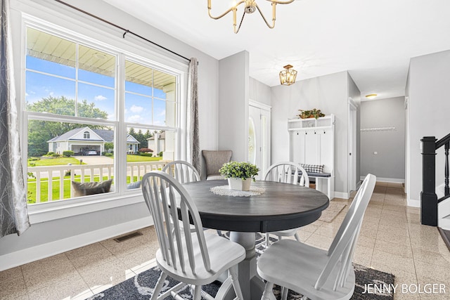 7066 Country Springs Dr SW, Byron Center, MI 49315 - dining room with a chandelier and dark speckled floor