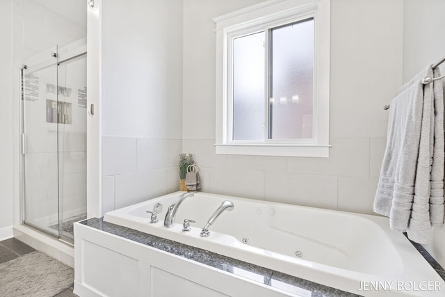 7066 Country Springs Dr SW, Byron Center, MI 49315 - full bath featuring healthy amount of natural light, a shower stall, and a whirlpool tub