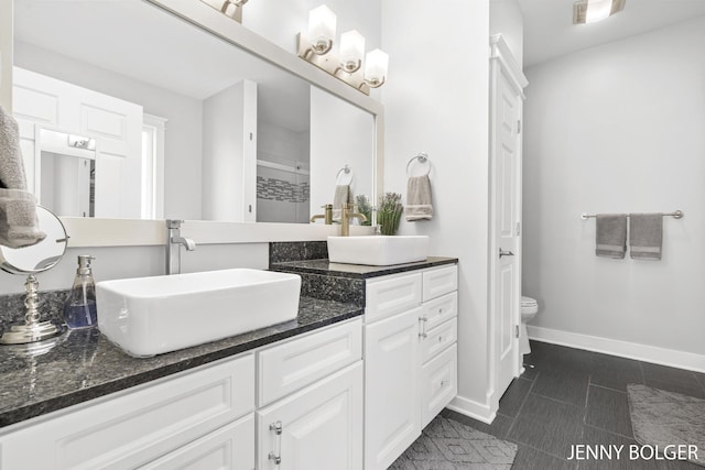 7066 Country Springs Dr SW, Byron Center, MI 49315 - bathroom featuring vanity, a shower, and tile patterned flooring