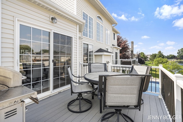 7066 Country Springs Dr SW, Byron Center, MI 49315 - wooden deck featuring outdoor dining space