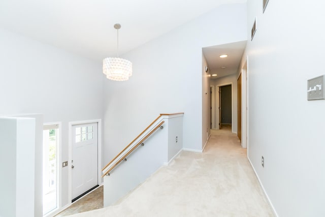 266 Westover Ave, Ann Arbor, MI 48103 - hall featuring an upstairs landing, a chandelier, light colored carpet, and a towering ceiling