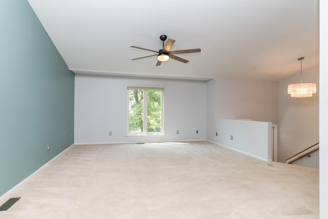 266 Westover Ave, Ann Arbor, MI 48103 - empty room with carpet, a ceiling fan, and a chandelier