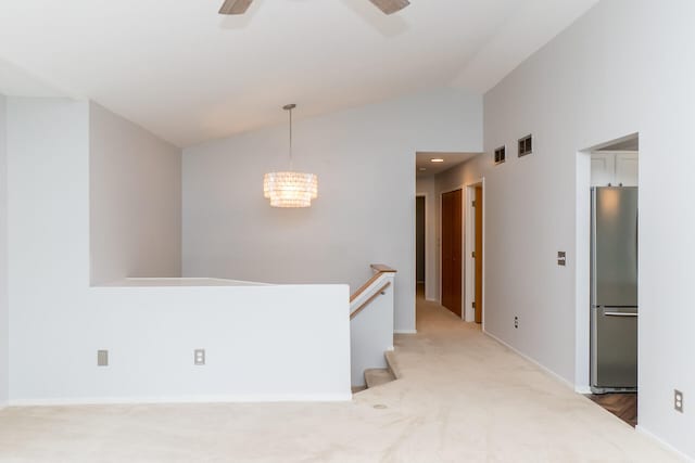 266 Westover Ave, Ann Arbor, MI 48103 - spare room featuring light colored carpet, a chandelier, a ceiling fan, and high vaulted ceiling
