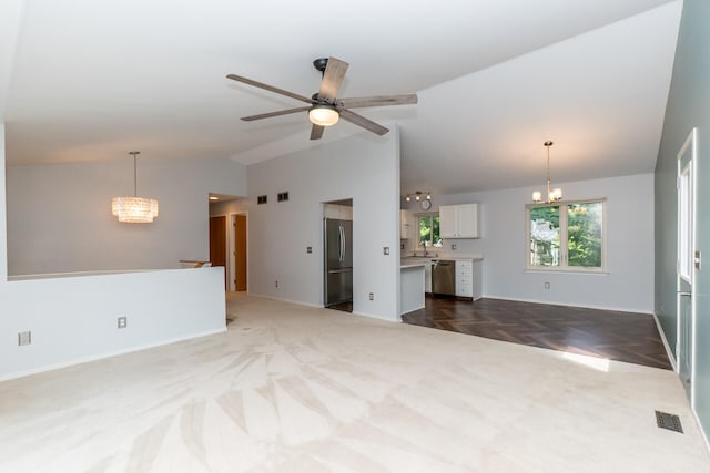 266 Westover Ave, Ann Arbor, MI 48103 - unfurnished living room with a chandelier, high vaulted ceiling, dark colored carpet, and a ceiling fan
