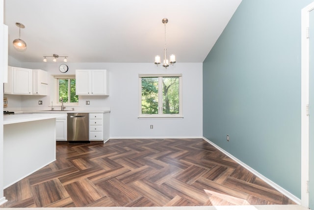 266 Westover Ave, Ann Arbor, MI 48103 - kitchen featuring stainless steel dishwasher, light countertops, a chandelier, white cabinets, and lofted ceiling