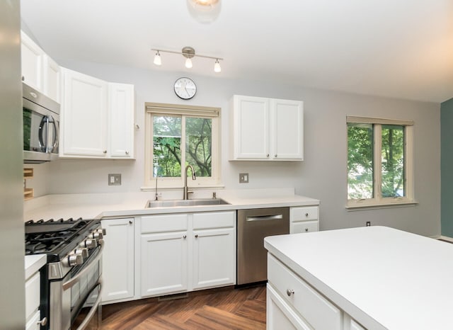 266 Westover Ave, Ann Arbor, MI 48103 - kitchen featuring appliances with stainless steel finishes, light countertops, and white cabinetry