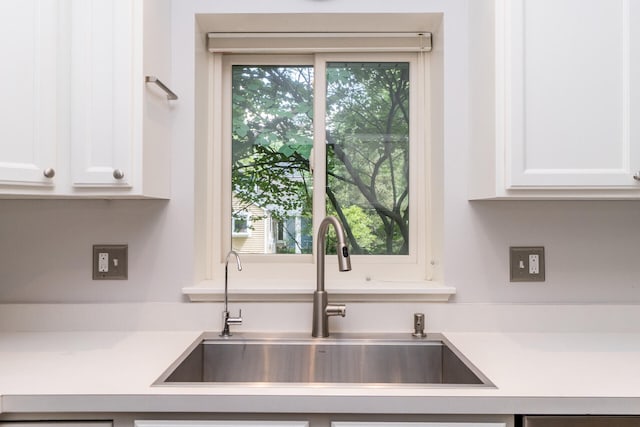 266 Westover Ave, Ann Arbor, MI 48103 - kitchen with light countertops, white cabinets, and healthy amount of natural light