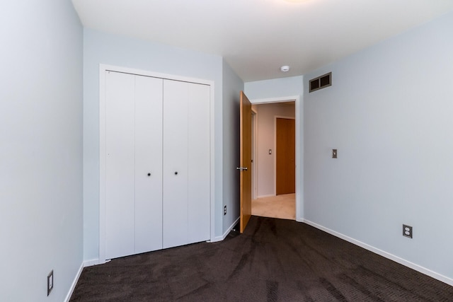266 Westover Ave, Ann Arbor, MI 48103 - unfurnished bedroom featuring a closet and dark colored carpet