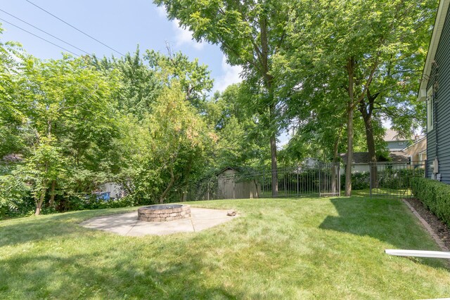 266 Westover Ave, Ann Arbor, MI 48103 - view of yard featuring an outdoor fire pit and a patio area