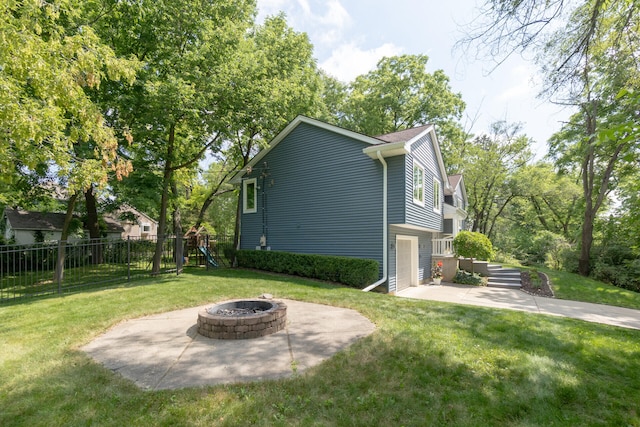 266 Westover Ave, Ann Arbor, MI 48103 - view of yard featuring a patio, an outdoor fire pit, and a playground
