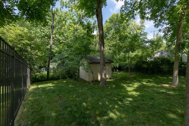 266 Westover Ave, Ann Arbor, MI 48103 - fenced backyard featuring a storage unit