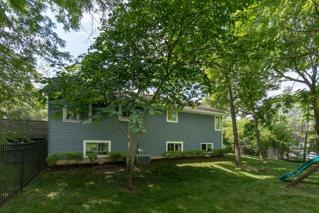 266 Westover Ave, Ann Arbor, MI 48103 - view of property exterior with a fenced backyard and a playground