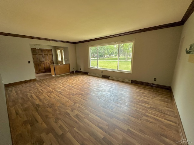 4650 Village Dr, Saginaw, MI 48638 - unfurnished living room with crown molding and wood finished floors