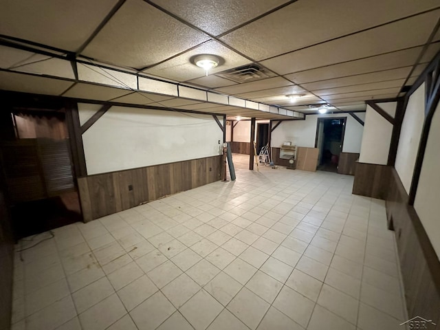 4650 Village Dr, Saginaw, MI 48638 - finished basement featuring wainscoting, wooden walls, and a paneled ceiling