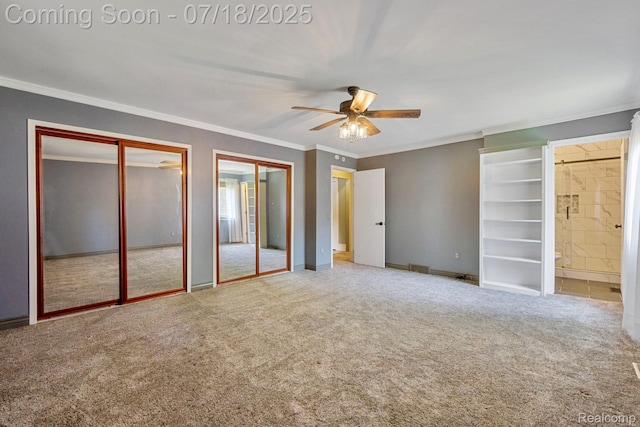 8400 Oak Shade Ct, Davison, MI 48423 - unfurnished bedroom featuring ornamental molding, carpet, two closets, ensuite bath, and a ceiling fan
