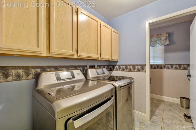 8400 Oak Shade Ct, Davison, MI 48423 - washroom with cabinet space, independent washer and dryer, a wainscoted wall, and light tile patterned floors