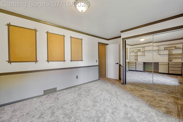 8400 Oak Shade Ct, Davison, MI 48423 - unfurnished bedroom with carpet, a closet, ornamental molding, and a desk