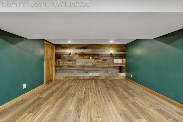 8400 Oak Shade Ct, Davison, MI 48423 - unfurnished living room featuring wooden walls, wood finished floors, and recessed lighting