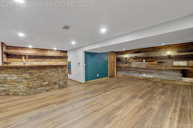 8400 Oak Shade Ct, Davison, MI 48423 - bar area with wood walls, light wood-style floors, and recessed lighting