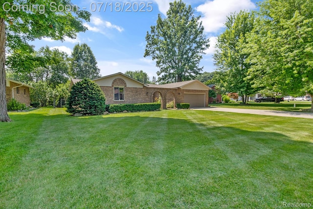 8400 Oak Shade Ct, Davison, MI 48423 - ranch-style house with an attached garage, concrete driveway, a front yard, and brick siding