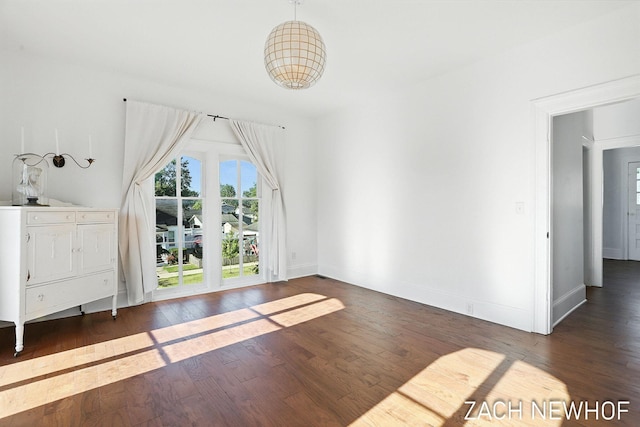 334 Washington Blvd, Holland, MI 49423 - unfurnished living room featuring hardwood / wood-style floors and baseboards
