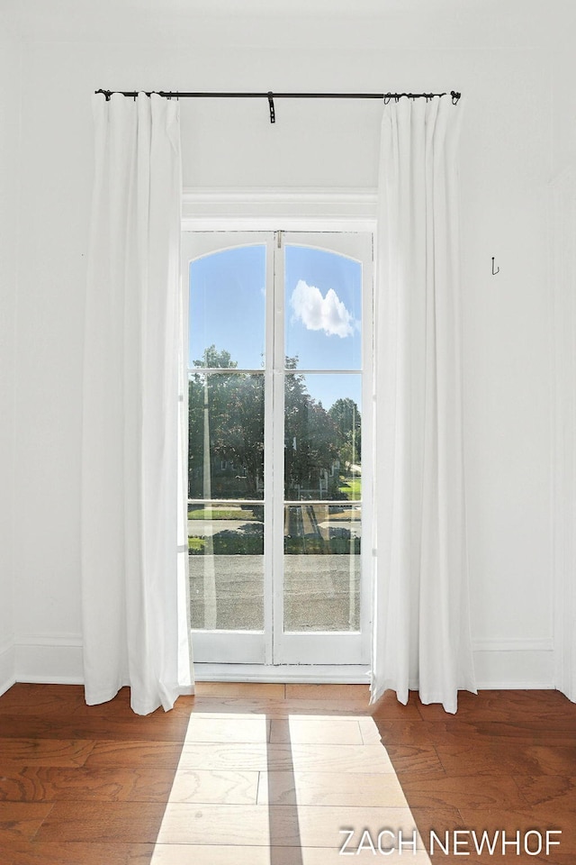334 Washington Blvd, Holland, MI 49423 - doorway to outside with wood finished floors and baseboards