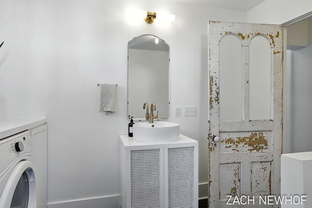 334 Washington Blvd, Holland, MI 49423 - bathroom featuring washer / dryer and vanity