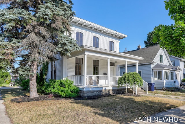 334 Washington Blvd, Holland, MI 49423 - italianate-style house with covered porch