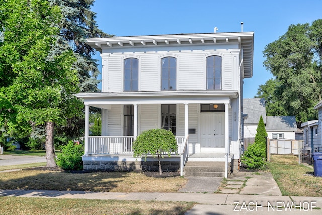 334 Washington Blvd, Holland, MI 49423 - italianate home featuring covered porch