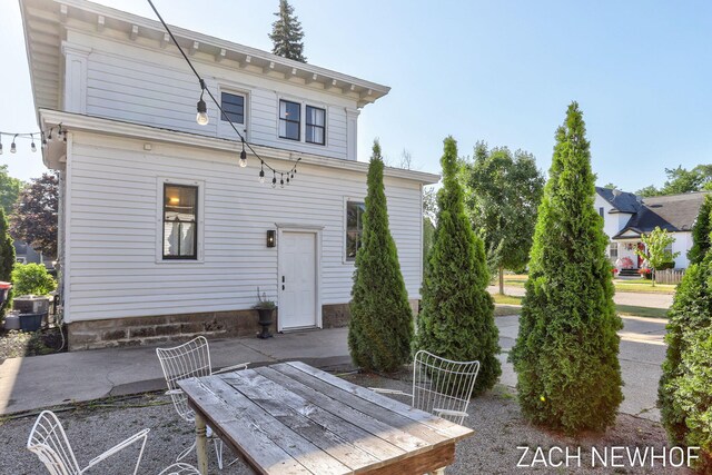 334 Washington Blvd, Holland, MI 49423 - rear view of property with a patio area and outdoor dining space