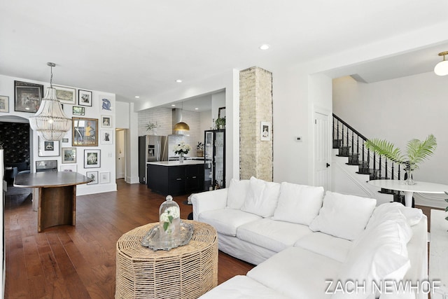 334 Washington Blvd, Holland, MI 49423 - living room with dark wood finished floors, stairs, and a chandelier