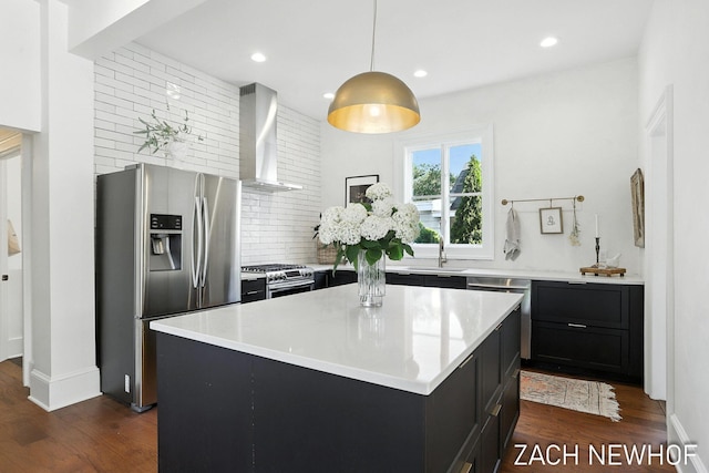 334 Washington Blvd, Holland, MI 49423 - kitchen with appliances with stainless steel finishes, wall chimney range hood, dark wood-style floors, backsplash, and recessed lighting