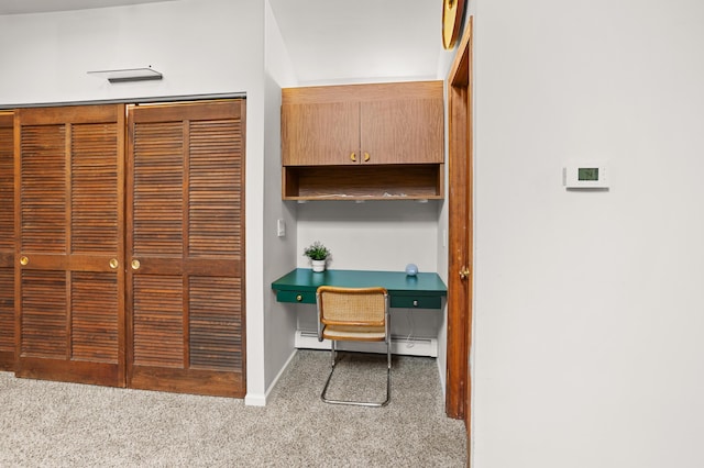 2323 Solano Dr, Wolverine Lake, MI 48390 - carpeted home office featuring built in desk and a baseboard radiator