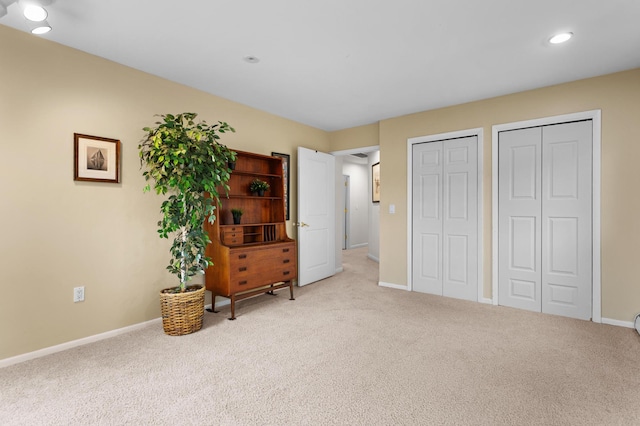 2323 Solano Dr, Wolverine Lake, MI 48390 - carpeted bedroom featuring multiple closets and recessed lighting