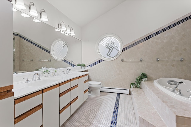2323 Solano Dr, Wolverine Lake, MI 48390 - bathroom with a baseboard radiator, double vanity, a bath, tile walls, and tile patterned floors