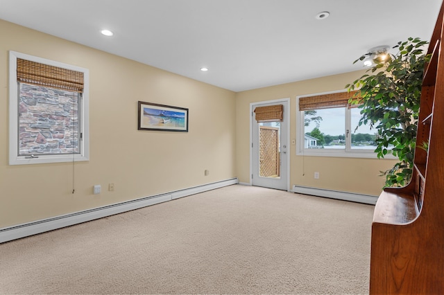 2323 Solano Dr, Wolverine Lake, MI 48390 - carpeted empty room featuring a baseboard radiator and recessed lighting