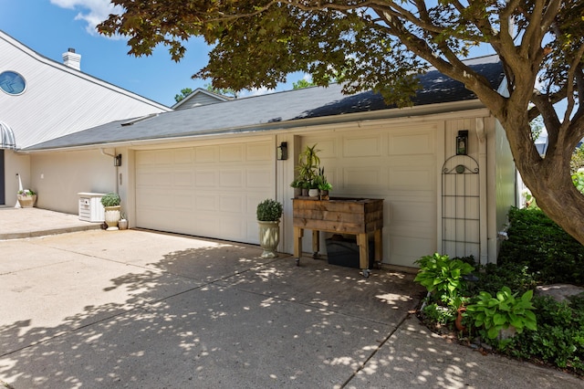 2323 Solano Dr, Wolverine Lake, MI 48390 - garage with concrete driveway