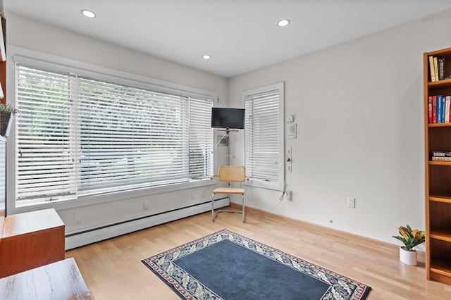 2323 Solano Dr, Wolverine Lake, MI 48390 - sitting room featuring plenty of natural light, baseboard heating, wood finished floors, and recessed lighting