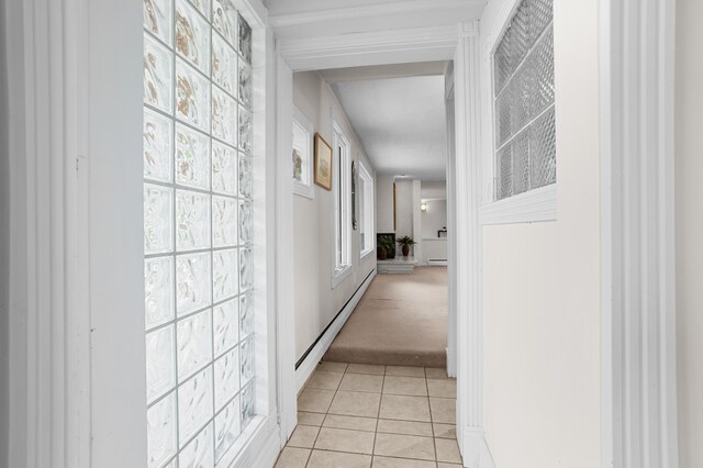 2323 Solano Dr, Wolverine Lake, MI 48390 - corridor with light tile patterned floors, light carpet, and baseboard heating
