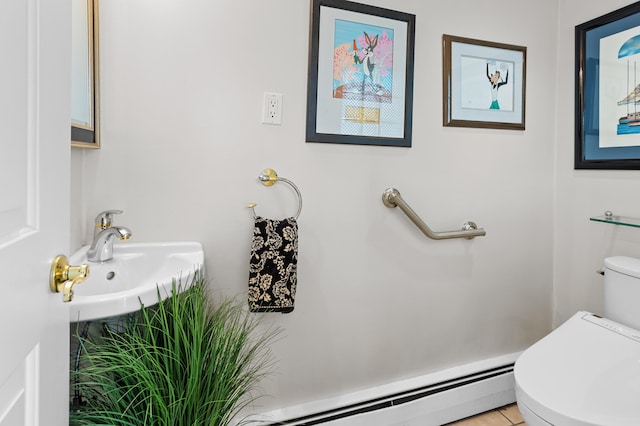 2323 Solano Dr, Wolverine Lake, MI 48390 - bathroom with a baseboard heating unit and tile patterned floors