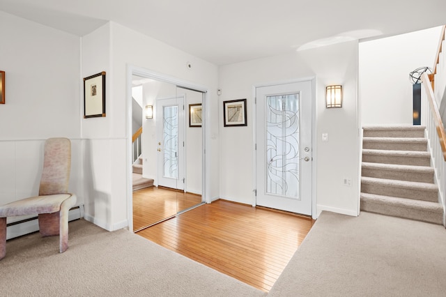 2323 Solano Dr, Wolverine Lake, MI 48390 - entrance foyer featuring stairway and hardwood / wood-style floors