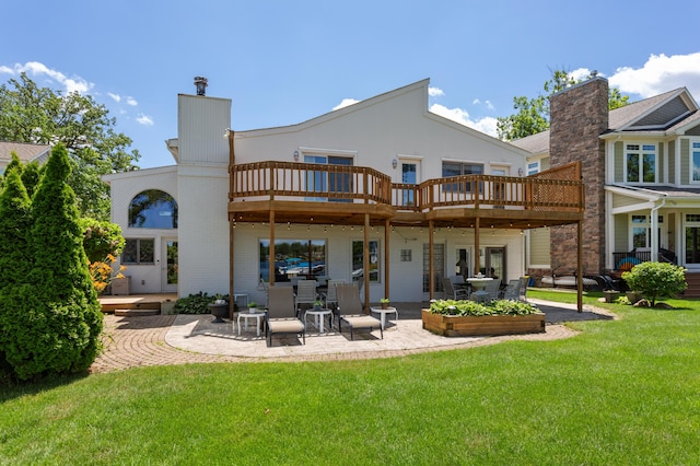 2323 Solano Dr, Wolverine Lake, MI 48390 - rear view of property with a patio, a yard, brick siding, and a wooden deck