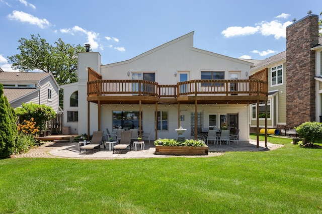 2323 Solano Dr, Wolverine Lake, MI 48390 - back of house featuring a patio area, a yard, and a wooden deck