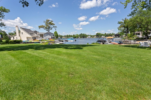 2323 Solano Dr, Wolverine Lake, MI 48390 - view of green lawn featuring a water view and a boat dock