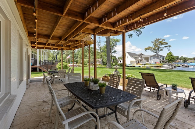 2323 Solano Dr, Wolverine Lake, MI 48390 - view of patio featuring outdoor dining space and a water view